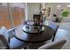 Dining area with a round table and four chairs near a window at 8605 W Paradise Dr, Peoria, AZ 85345