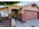 House exterior showcasing a two-tone paint scheme and a neatly kept walkway at 8605 W Paradise Dr, Peoria, AZ 85345