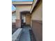 Front entryway with stone walkway leading to a tan door at 8605 W Paradise Dr, Peoria, AZ 85345