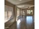 Open concept living area with tile floors and access to backyard at 8605 W Paradise Dr, Peoria, AZ 85345