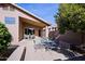 Outdoor patio with seating and a metal table set at 8605 W Paradise Dr, Peoria, AZ 85345