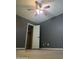 Spacious bedroom with ceiling fan and walk-in closet at 8719 N Fountain Dr, Peoria, AZ 85345