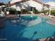 Community swimming pool with surrounding lounge chairs at 8719 N Fountain Dr, Peoria, AZ 85345