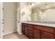 Double vanity bathroom with granite countertop and tile floor at 900 S Canal Dr # 224, Chandler, AZ 85225