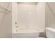 Clean bathroom with a shower/tub combo and white tile at 900 S Canal Dr # 224, Chandler, AZ 85225