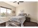 Spacious bedroom with large window and wood bed frame at 900 S Canal Dr # 224, Chandler, AZ 85225