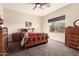 Cozy bedroom with wood furniture and carpeted flooring at 900 S Canal Dr # 224, Chandler, AZ 85225