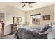 Comfortable bedroom with a dresser and large window offering natural light at 900 S Canal Dr # 224, Chandler, AZ 85225