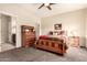 Spacious bedroom with wood furniture and ensuite bathroom at 900 S Canal Dr # 224, Chandler, AZ 85225