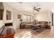 Bright living room featuring tile floors, comfortable seating, and a fireplace at 900 S Canal Dr # 224, Chandler, AZ 85225