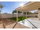 Artificial turf backyard with covered patio and walkway at 901 N Longmore St, Chandler, AZ 85224