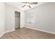 Spacious bedroom with wood-look floors, closet, and window blinds at 901 N Longmore St, Chandler, AZ 85224