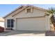 Single story home with a two car garage and desert landscaping at 901 N Longmore St, Chandler, AZ 85224