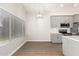 Modern kitchen with gray cabinets, white quartz countertops, and stainless steel appliances at 901 N Longmore St, Chandler, AZ 85224