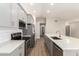 Modern kitchen with gray cabinets, white quartz countertops and stainless steel appliances at 901 N Longmore St, Chandler, AZ 85224