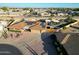 Aerial view of house with solar panels, landscaping, and driveway at 9101 W Willow Haven Ct, Sun City, AZ 85351