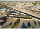 Aerial view showcasing the home's backyard, pool, and putting green at 9101 W Willow Haven Ct, Sun City, AZ 85351