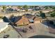 Aerial view of the home's exterior, highlighting its landscaping and driveway at 9101 W Willow Haven Ct, Sun City, AZ 85351