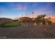 Landscaped backyard with putting green at 9101 W Willow Haven Ct, Sun City, AZ 85351