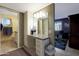 Bathroom with granite vanity and a view of the shower and toilet at 9101 W Willow Haven Ct, Sun City, AZ 85351