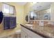 Bathroom with granite countertop, updated shower, and plenty of storage at 9101 W Willow Haven Ct, Sun City, AZ 85351