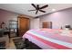 Bright bedroom with a queen-size bed and ample closet space at 9101 W Willow Haven Ct, Sun City, AZ 85351