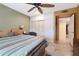 Spacious bedroom with ample closet space and ceiling fan at 9101 W Willow Haven Ct, Sun City, AZ 85351