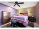 Cozy bedroom featuring a full-size bed and wooden dresser at 9101 W Willow Haven Ct, Sun City, AZ 85351