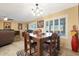 Casual dining area with square table and four chairs at 9101 W Willow Haven Ct, Sun City, AZ 85351