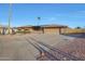 Single-story home with a landscaped yard and two-car garage at 9101 W Willow Haven Ct, Sun City, AZ 85351