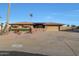 Single story home with a landscaped yard and two-car garage at 9101 W Willow Haven Ct, Sun City, AZ 85351