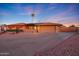 Single-story home with a large driveway at 9101 W Willow Haven Ct, Sun City, AZ 85351