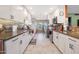 Modern kitchen featuring white cabinetry and a center island at 9101 W Willow Haven Ct, Sun City, AZ 85351