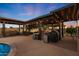 Covered patio with outdoor kitchen and grill at 9101 W Willow Haven Ct, Sun City, AZ 85351