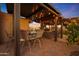 Outdoor table and chairs under covered patio at 9101 W Willow Haven Ct, Sun City, AZ 85351