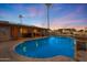 Large pool with a swim-up bar and patio furniture at 9101 W Willow Haven Ct, Sun City, AZ 85351