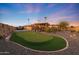 Landscaped backyard putting green at 9101 W Willow Haven Ct, Sun City, AZ 85351