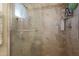 Large walk-in shower with tiled walls and seat at 9101 W Willow Haven Ct, Sun City, AZ 85351