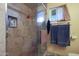 Shower with tiled walls and built-in shelving at 9101 W Willow Haven Ct, Sun City, AZ 85351