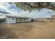 Large backyard with a covered patio and wooden fence at 9144 E Balsam Ave, Mesa, AZ 85208