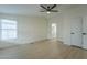 Bright bedroom with ceiling fan and ensuite bathroom access at 9144 E Balsam Ave, Mesa, AZ 85208