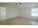 Bright bedroom with ceiling fan and window with blinds at 9144 E Balsam Ave, Mesa, AZ 85208