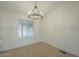 Bright dining room featuring hardwood floors and a stylish chandelier at 9144 E Balsam Ave, Mesa, AZ 85208