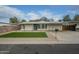 Newly renovated home with artificial turf and covered parking at 9144 E Balsam Ave, Mesa, AZ 85208