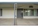 Gray front door entry with decorative columns and covered porch at 9144 E Balsam Ave, Mesa, AZ 85208