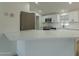 Modern kitchen with white cabinets and sleek stainless steel appliances at 9144 E Balsam Ave, Mesa, AZ 85208