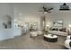 Virtually staged living room with contemporary furnishings and hardwood floors at 9144 E Balsam Ave, Mesa, AZ 85208