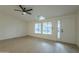 Bright living room with hardwood floors, ceiling fan, and entryway at 9144 E Balsam Ave, Mesa, AZ 85208