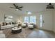 Virtually staged living room featuring hardwood floors and stylish decor at 9144 E Balsam Ave, Mesa, AZ 85208