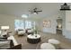 Virtually staged living room with open layout to adjacent bedroom at 9144 E Balsam Ave, Mesa, AZ 85208